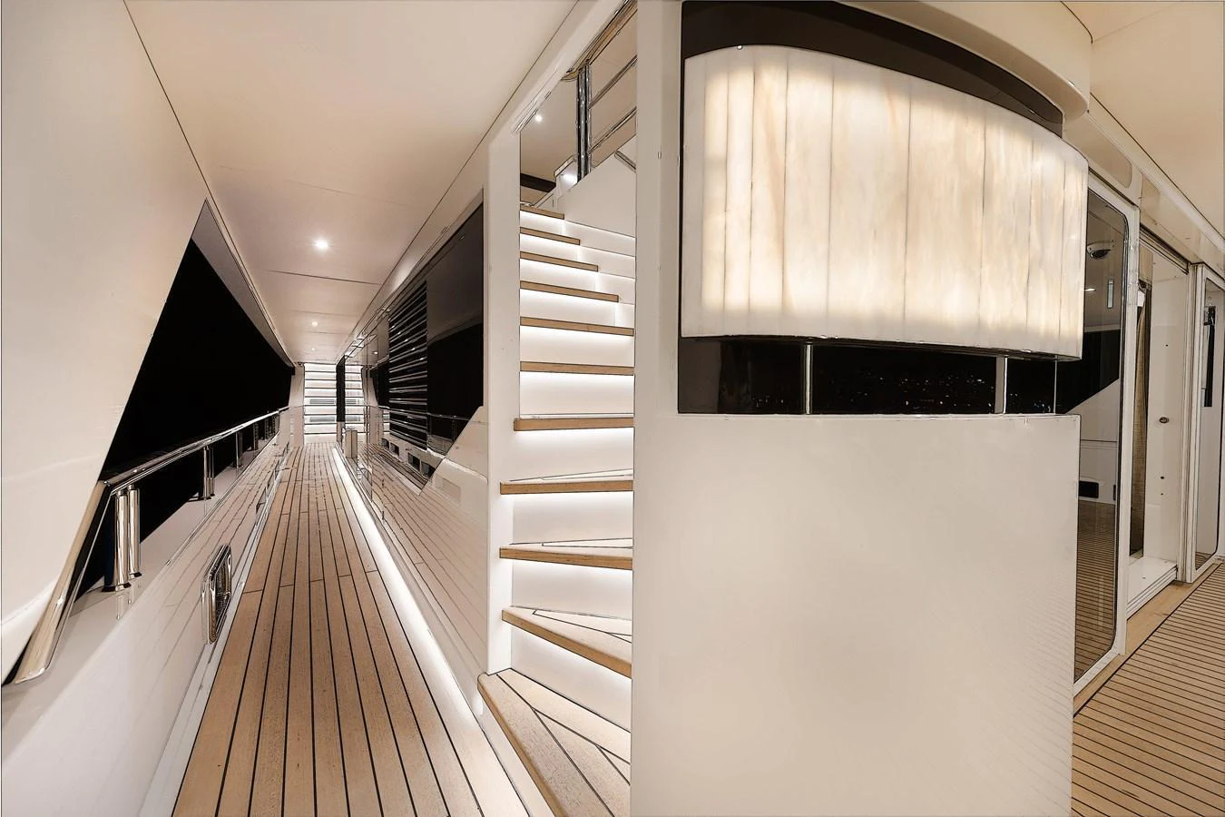 A sleek and modern hallway with elegant lighting and wooden flooring. aboard CMB47-107 Yacht for Sale