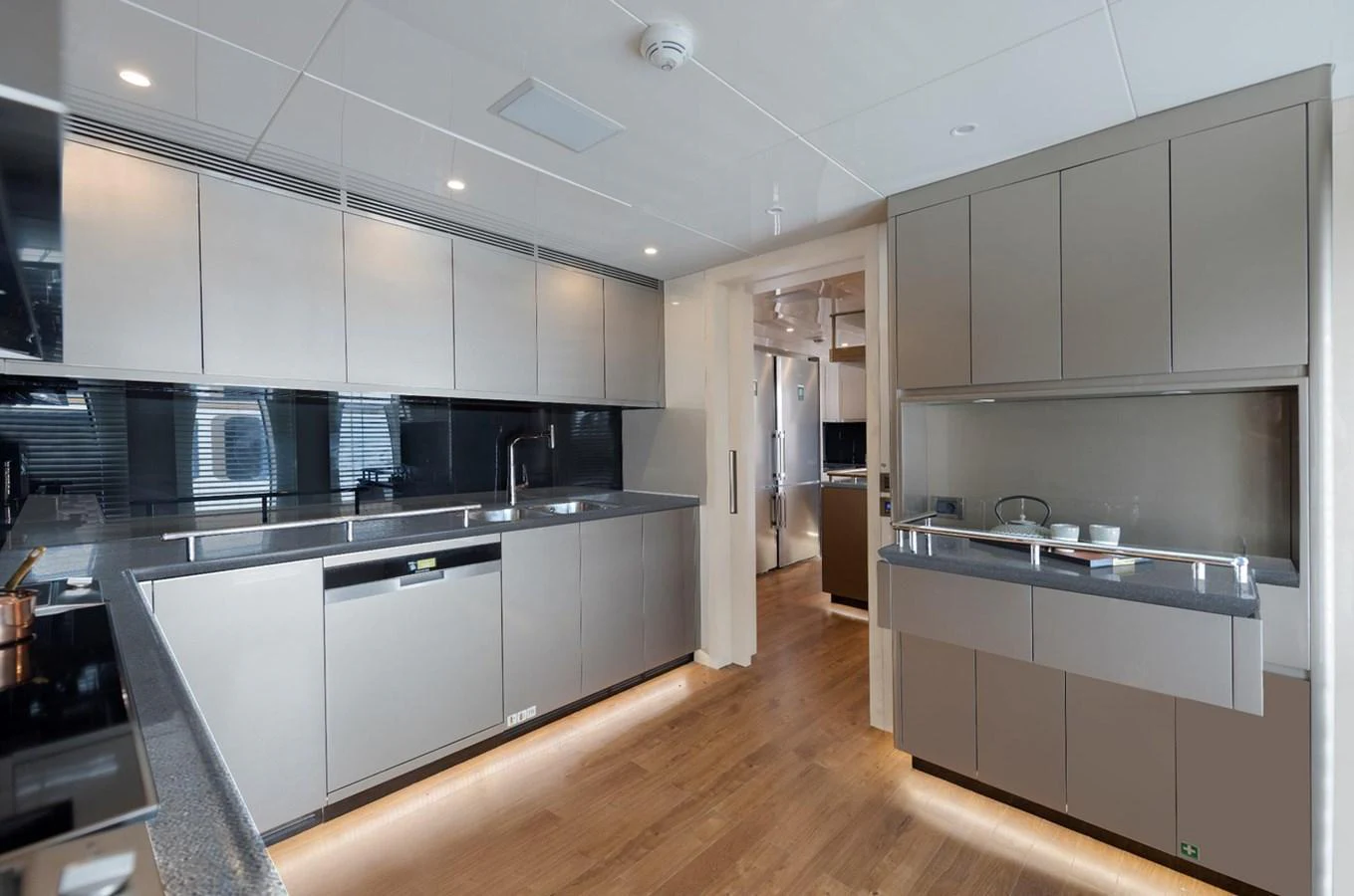 The yacht's galley features modern appliances and sleek cabinetry, offering a spacious and functional cooking area. aboard CMB47-107 Yacht for Sale