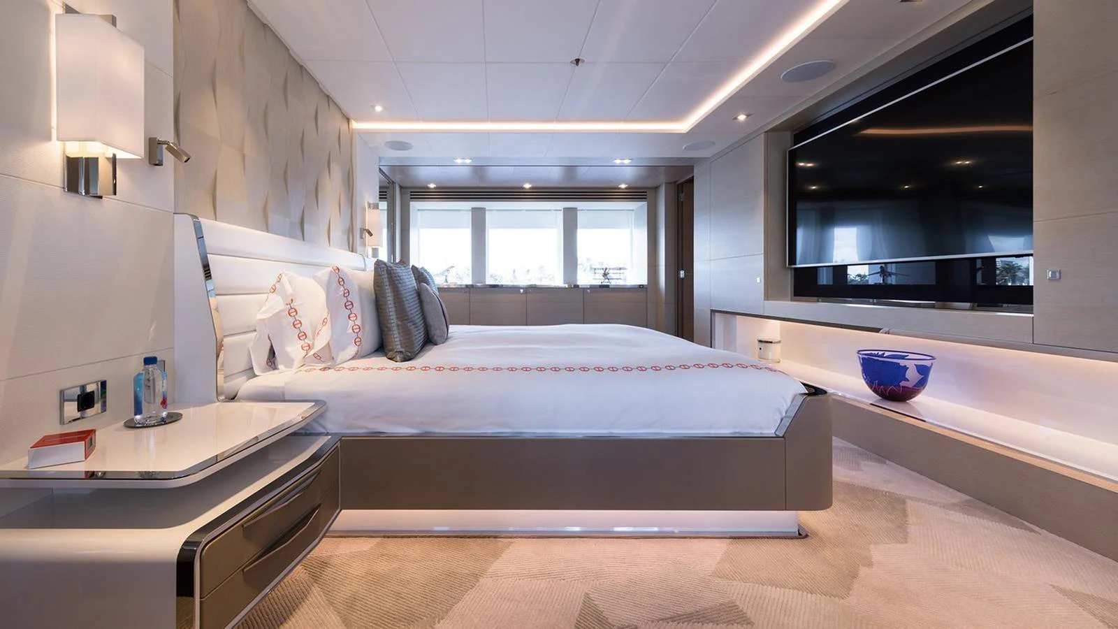 The master stateroom exudes luxury with its spacious layout, modern design, and large windows offering natural light. aboard HEESEN 47M Yacht for Sale