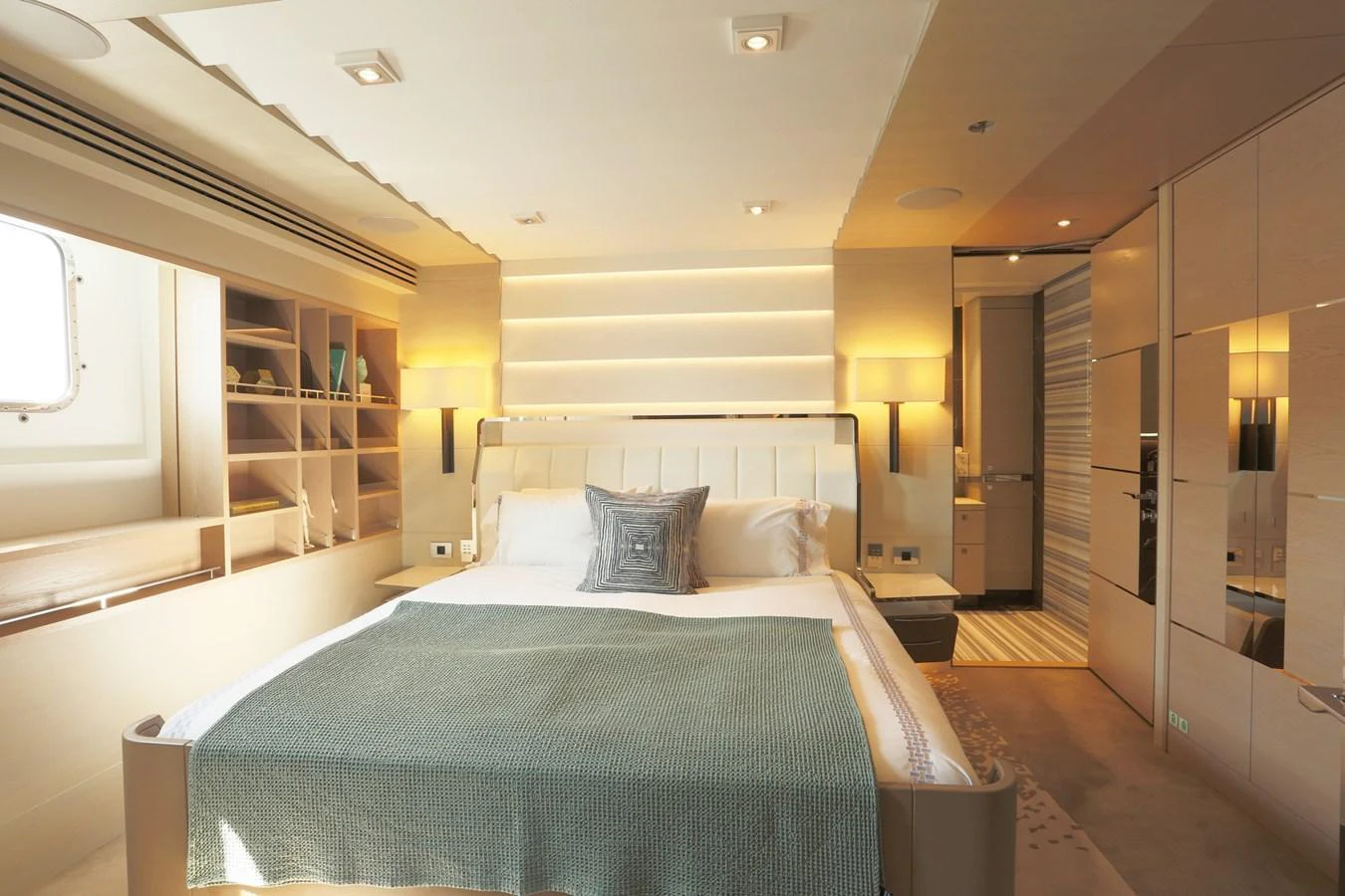 A luxurious stateroom featuring a large bed, ambient lighting, and elegant decor. aboard HEESEN 47M Yacht for Sale