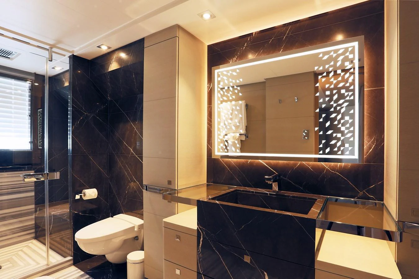 The yacht's bathroom features luxurious marble finishes and modern fixtures. aboard HEESEN 47M Yacht for Sale