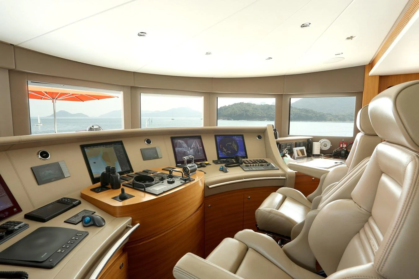 The helm station offers a panoramic view with state-of-the-art navigation equipment and luxurious seating. aboard HEESEN 47M Yacht for Sale