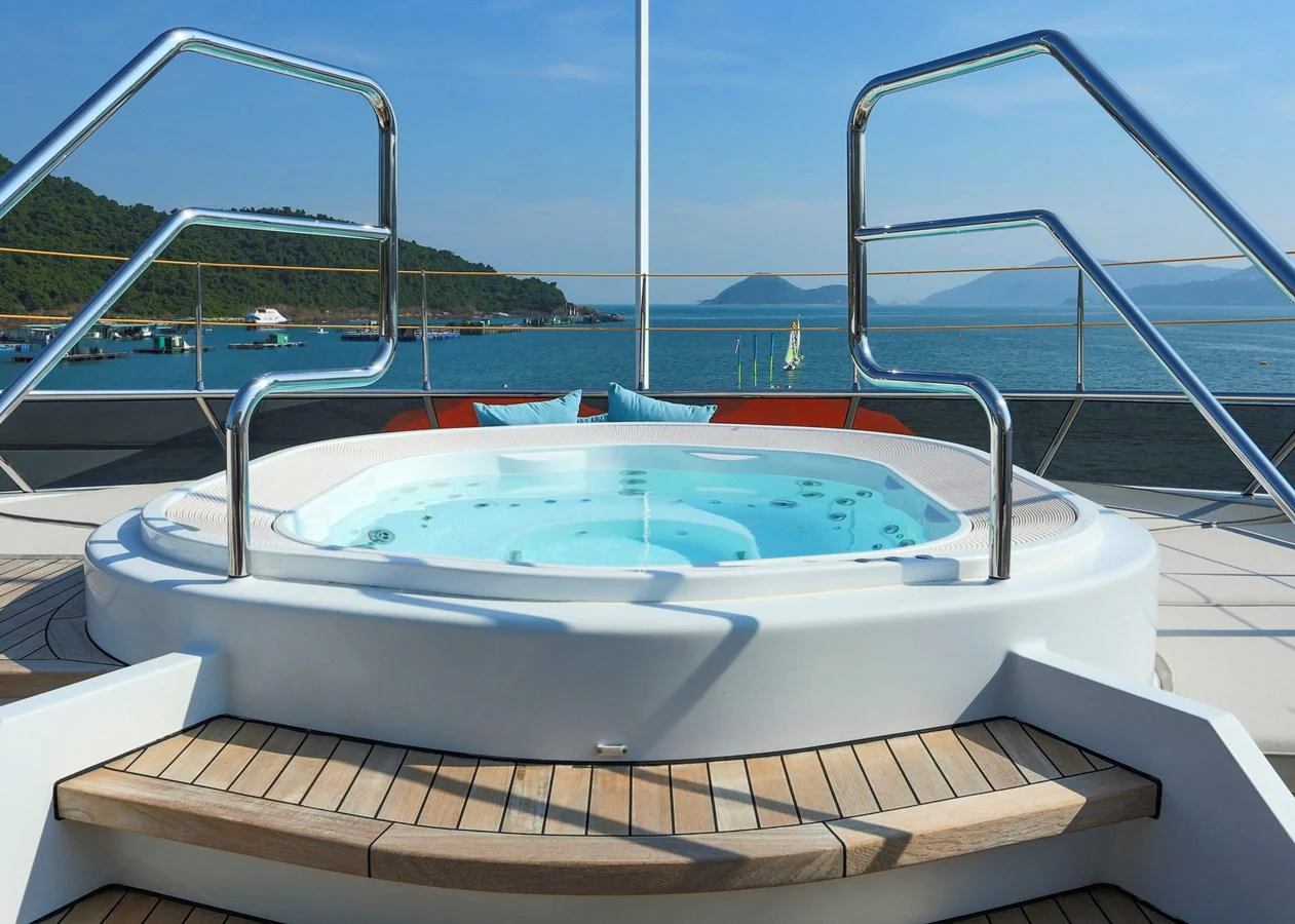 The yacht features a luxurious jacuzzi on the deck with stunning sea views. aboard HEESEN 47M Yacht for Sale