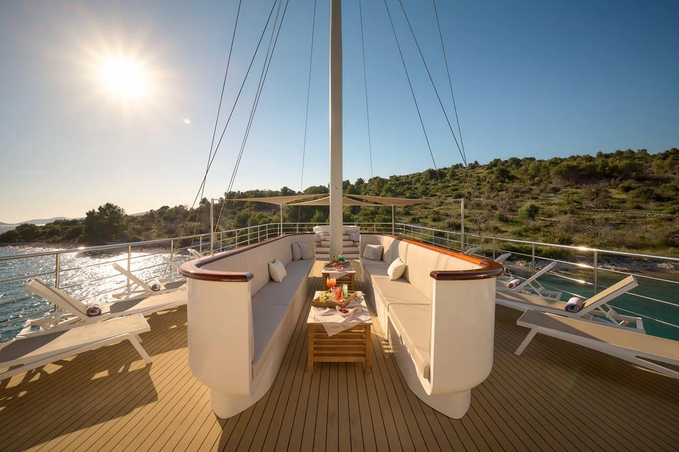 The sundeck offers a luxurious space for relaxation with comfortable seating and scenic views. aboard BELLEZZA Yacht for Sale