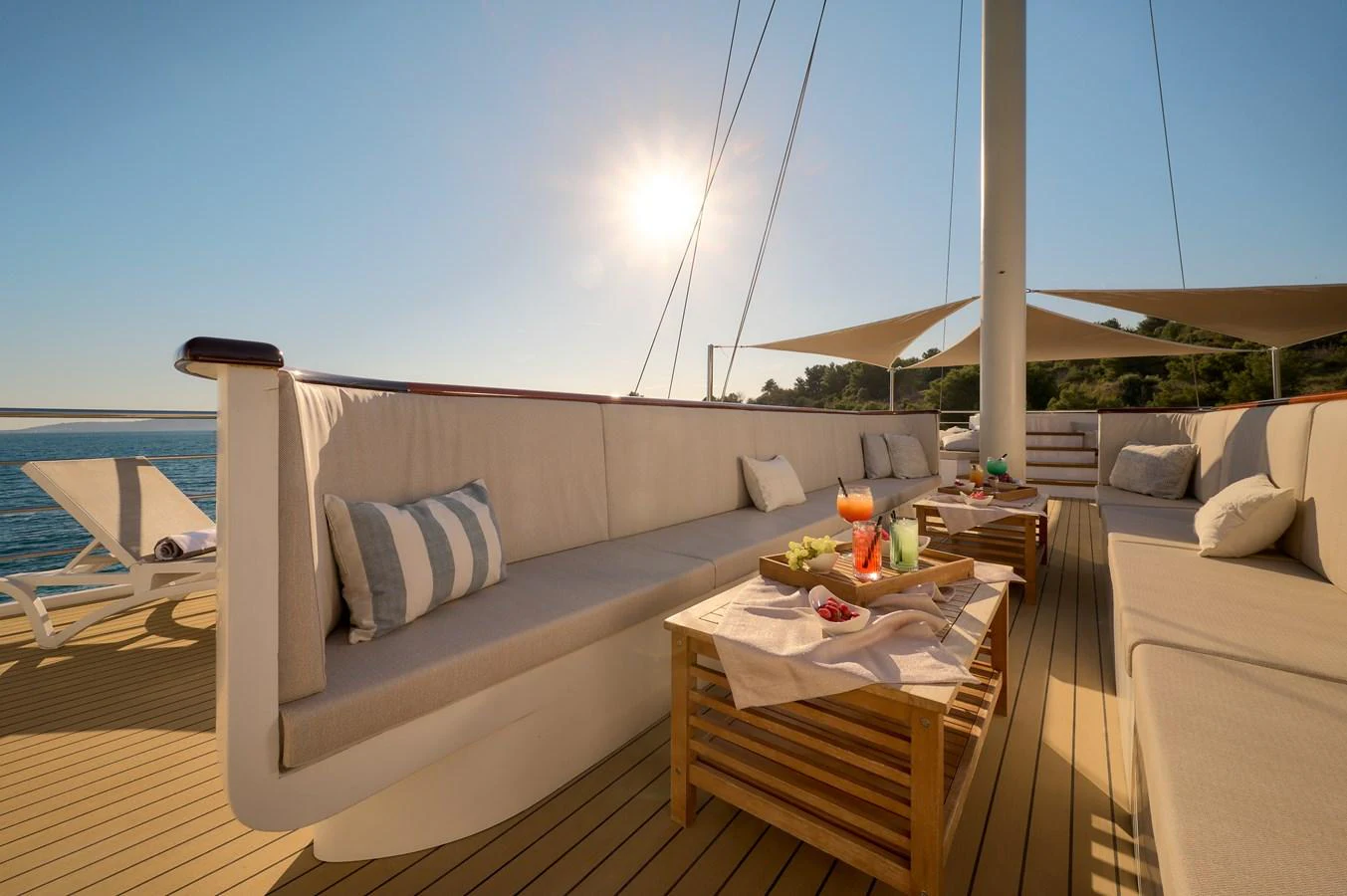 The sundeck offers a luxurious lounging area with comfortable seating and refreshments under the sun. aboard BELLEZZA Yacht for Sale