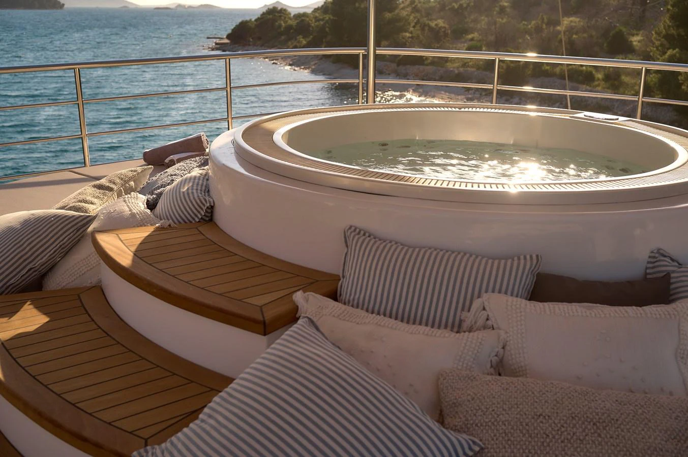 A luxurious jacuzzi on the yacht's deck offers a serene spot to relax with stunning ocean views. aboard BELLEZZA Yacht for Sale