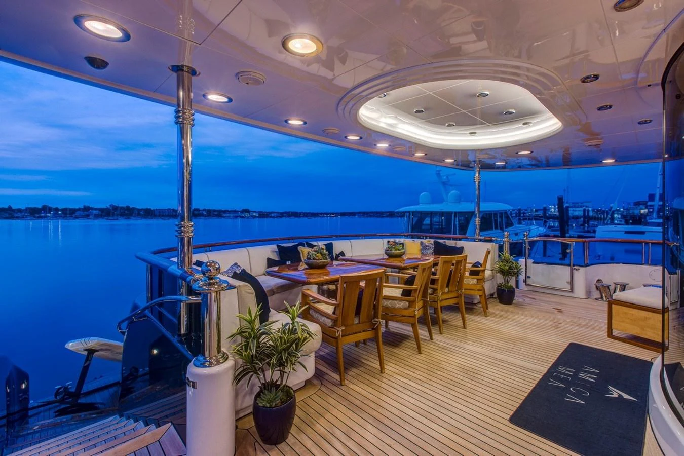 a room with a table and chairs aboard AMICA MEA Yacht for Sale
