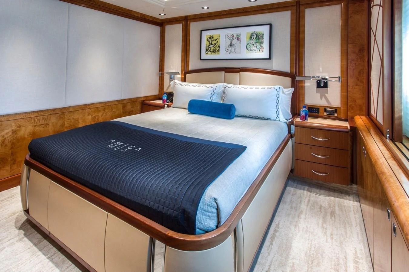a bed with blue sheets aboard AMICA MEA Yacht for Sale