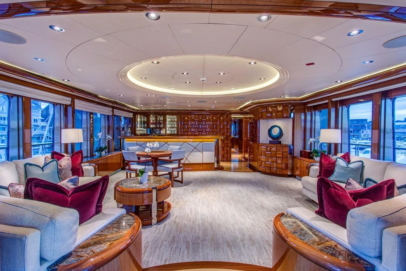 a large living room with a large window aboard AMICA MEA Yacht for Sale