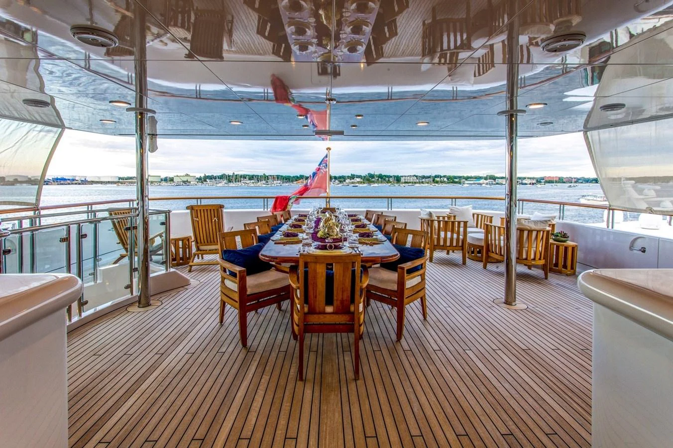 a table set up on a deck aboard AMICA MEA Yacht for Sale