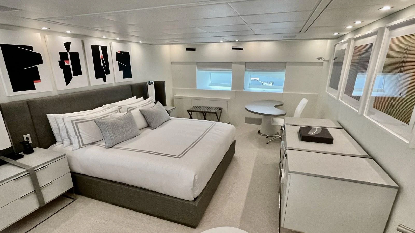 The master stateroom features a luxurious bed, modern decor, and ample natural light. aboard D'ONE D Yacht for Sale
