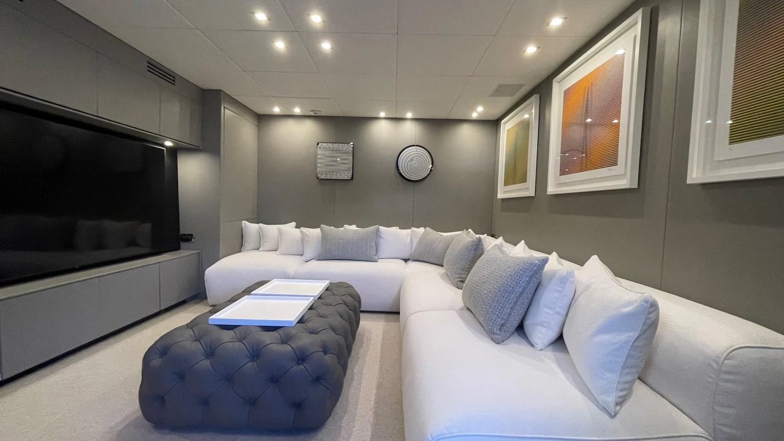 The yacht's salon features a spacious and modern seating area with plush white sofas and contemporary decor. aboard D'ONE D Yacht for Sale