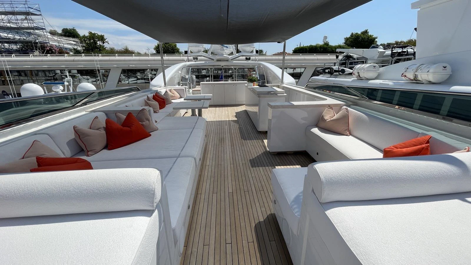The sundeck features ample seating with plush cushions and a shaded area for relaxation. aboard D'ONE D Yacht for Sale