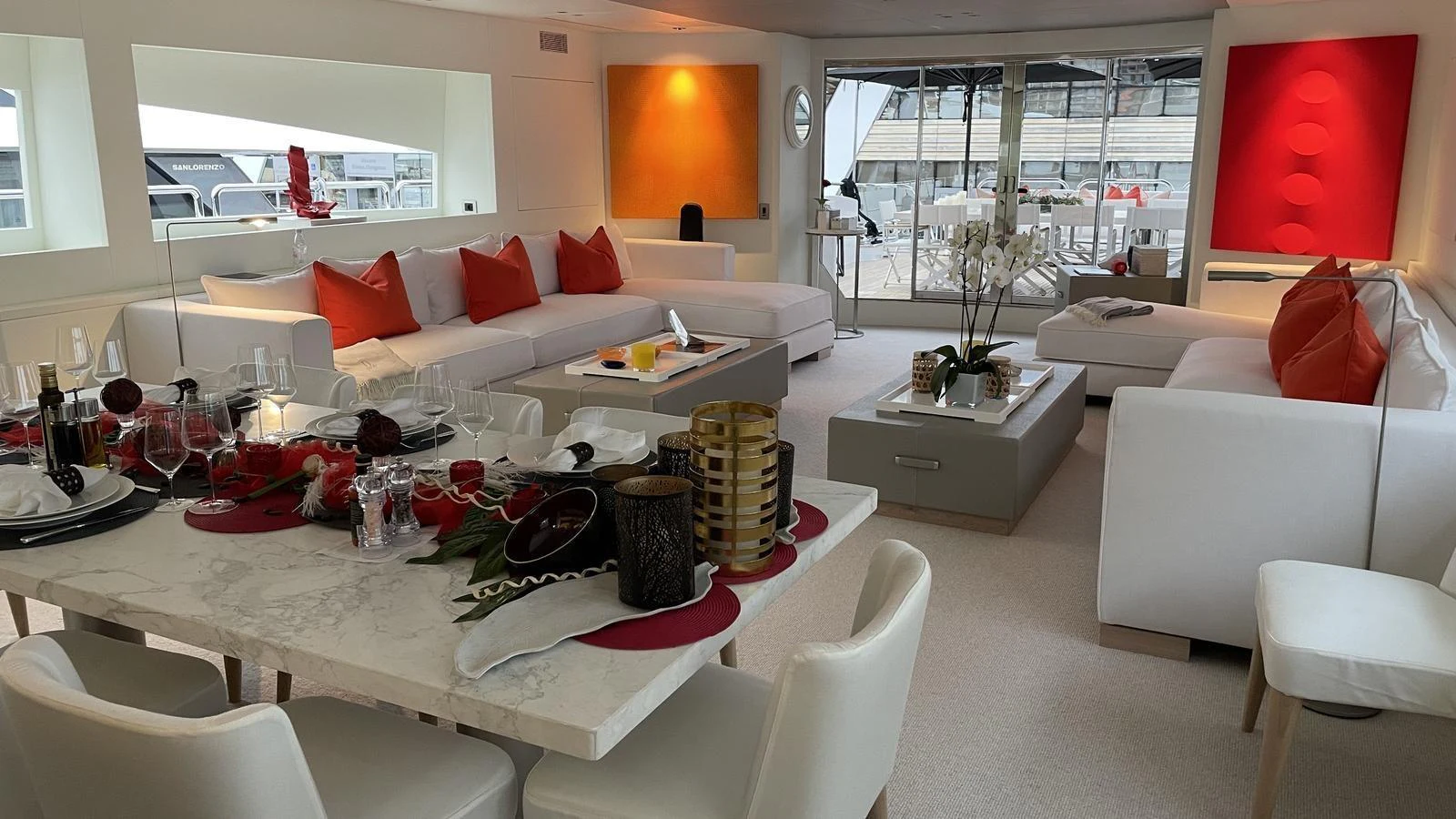 The salon features a modern and spacious layout with elegant furnishings and vibrant accents. aboard D'ONE D Yacht for Sale
