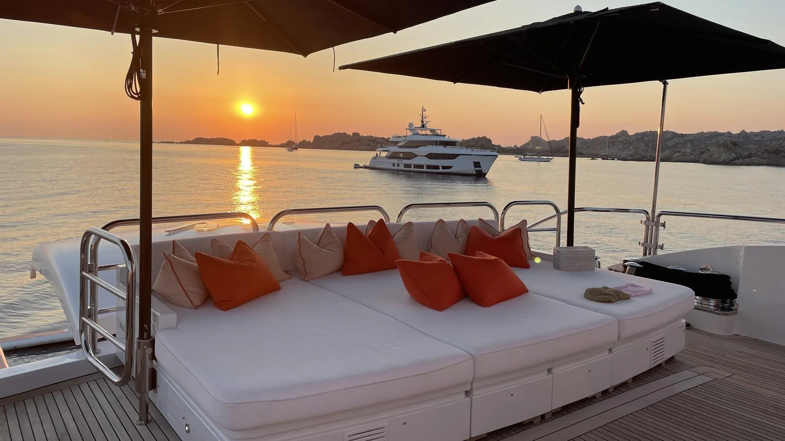 The sundeck offers a luxurious lounging area with plush cushions, perfect for enjoying the sunset. aboard D'ONE D Yacht for Sale
