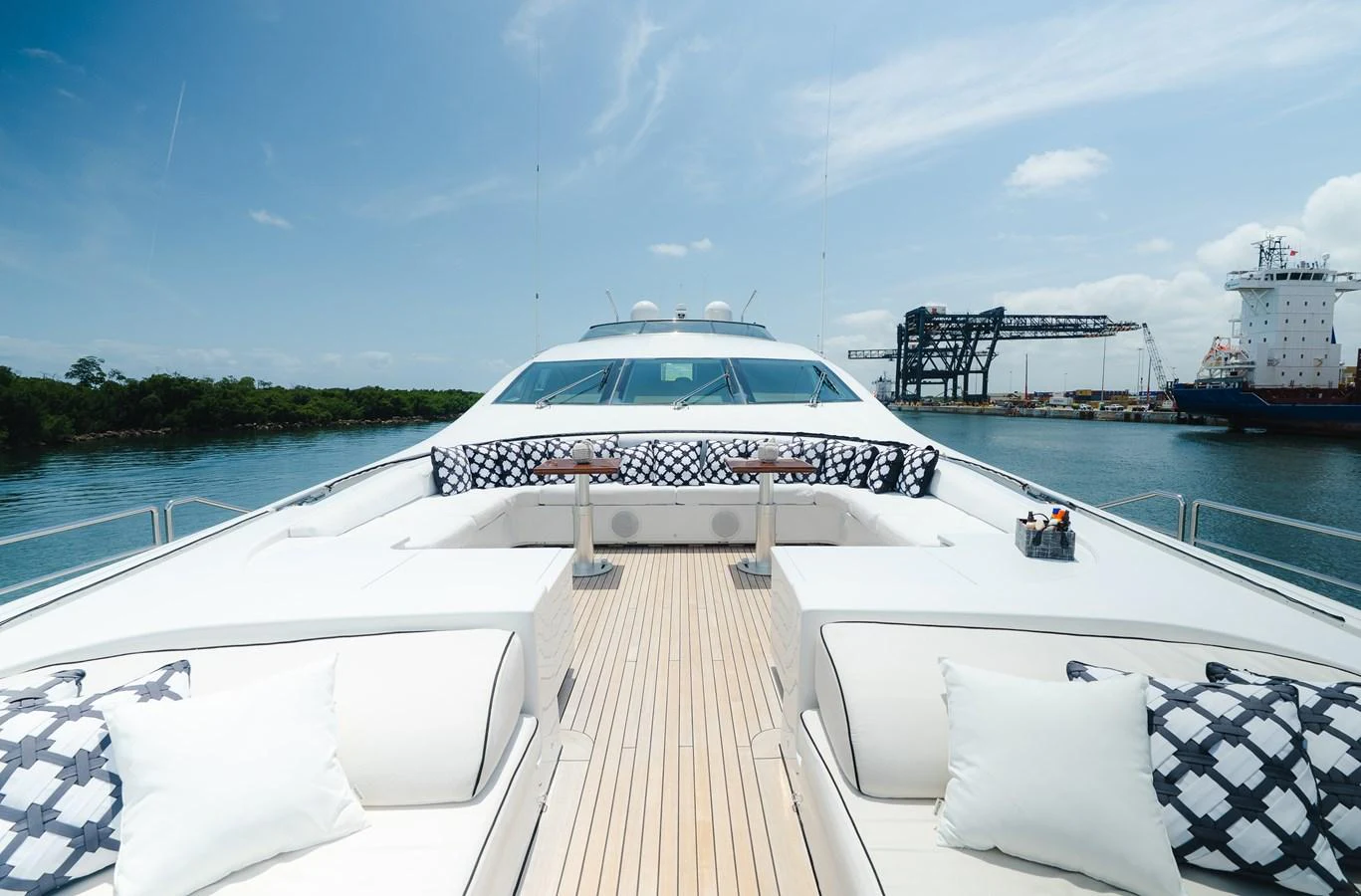 The foredeck of this yacht features spacious seating with plush cushions and a sleek, modern design. aboard BET ON IT Yacht for Sale