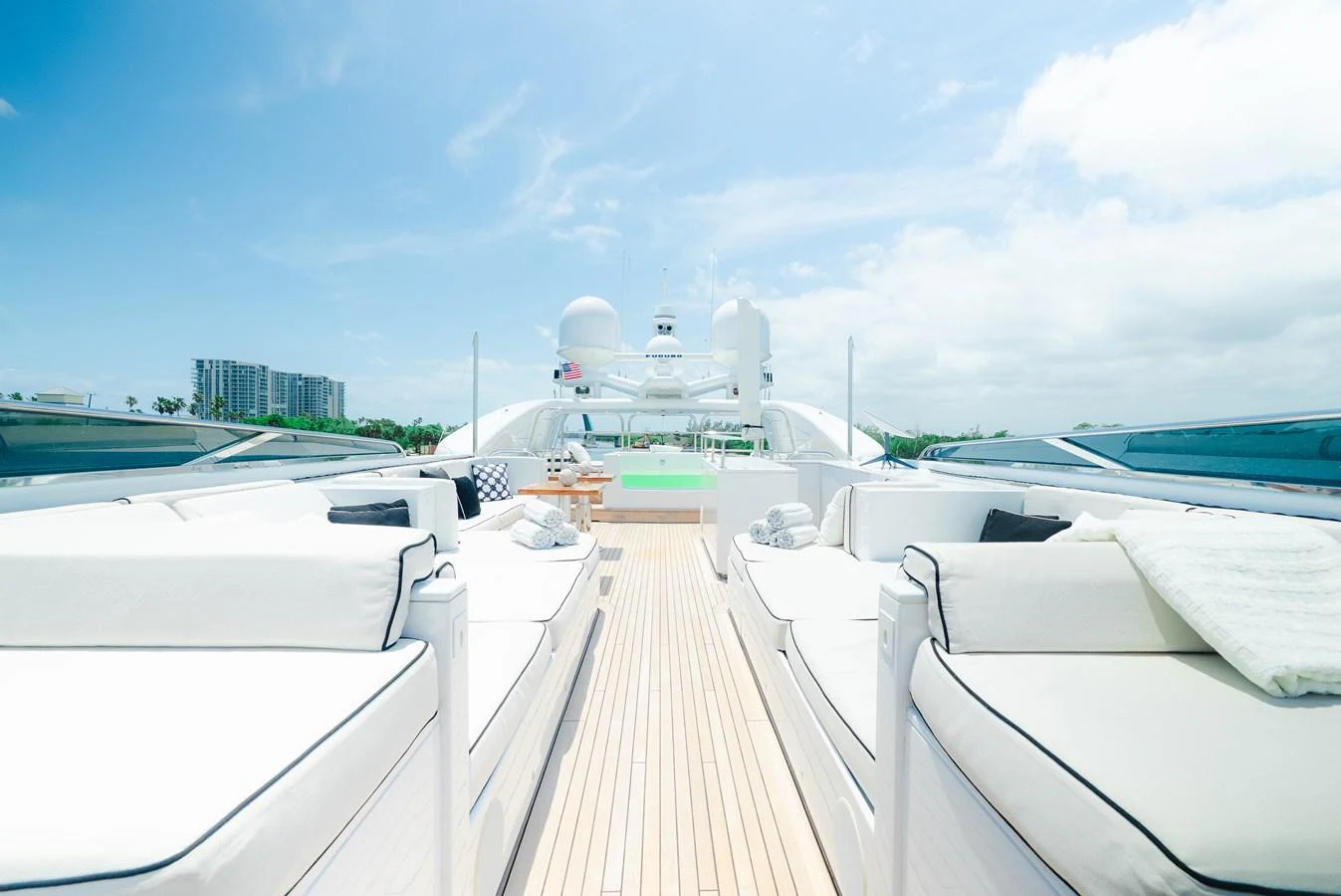 The sundeck offers luxurious lounging areas with plush seating and panoramic views. aboard BET ON IT Yacht for Sale