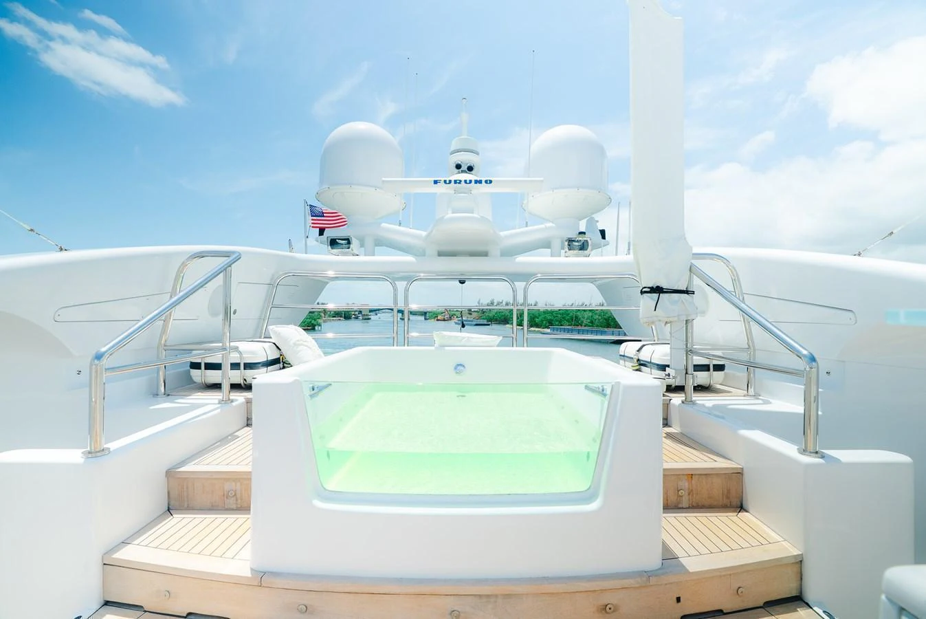 The sundeck features a luxurious jacuzzi with a stunning view of the sky and surroundings. aboard BET ON IT Yacht for Sale