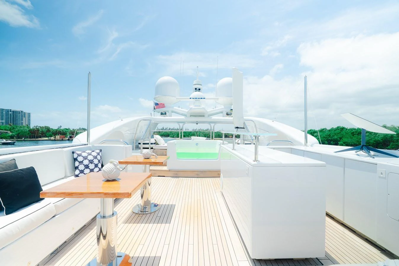 The sundeck offers a spacious and luxurious area for relaxation and entertainment with ample seating and modern amenities. aboard BET ON IT Yacht for Sale