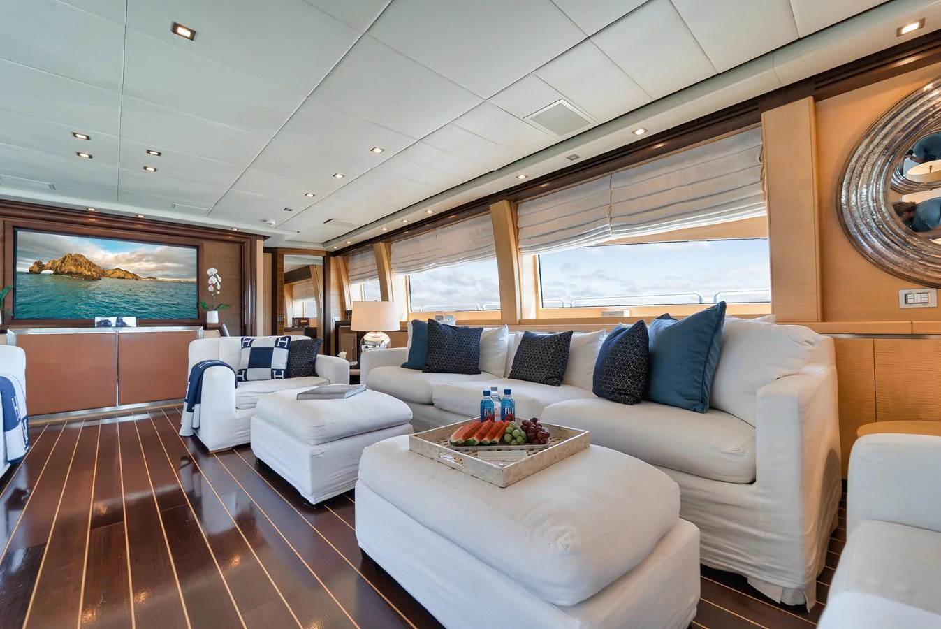The salon offers a spacious and luxurious seating area with large windows providing stunning views. aboard BET ON IT Yacht for Sale