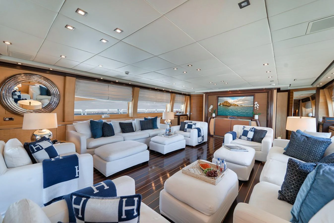 The spacious salon features luxurious seating and elegant decor, perfect for relaxation and socializing. aboard BET ON IT Yacht for Sale