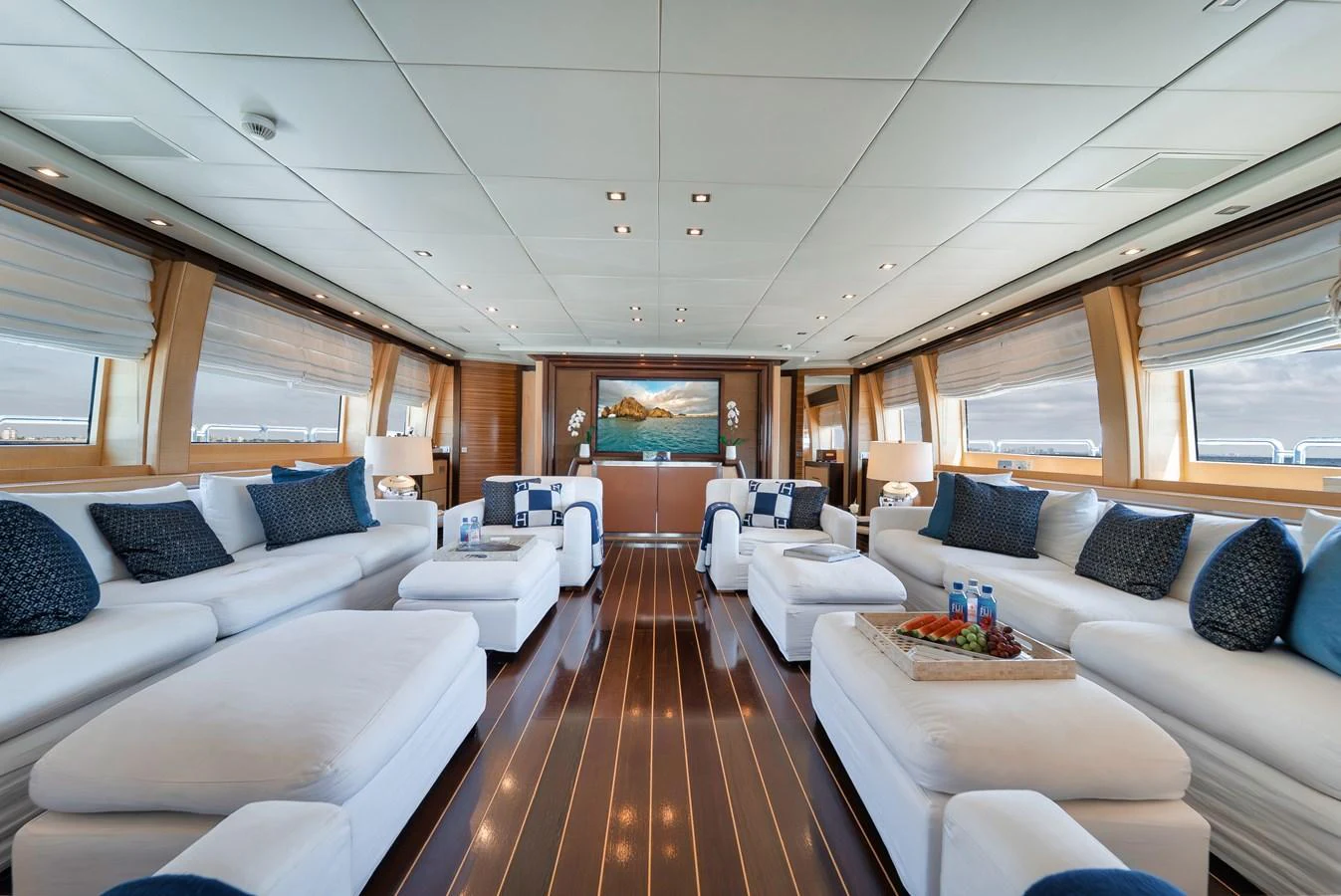 The spacious salon features luxurious seating and elegant decor, perfect for relaxation and socializing. aboard BET ON IT Yacht for Sale