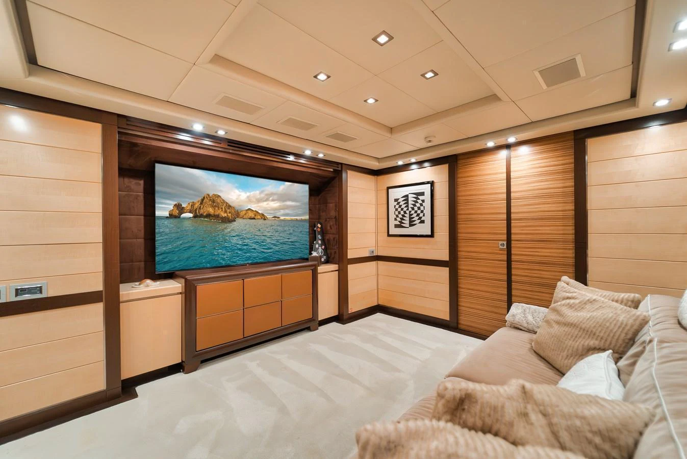 The yacht's media room offers a luxurious and comfortable space for entertainment. aboard BET ON IT Yacht for Sale