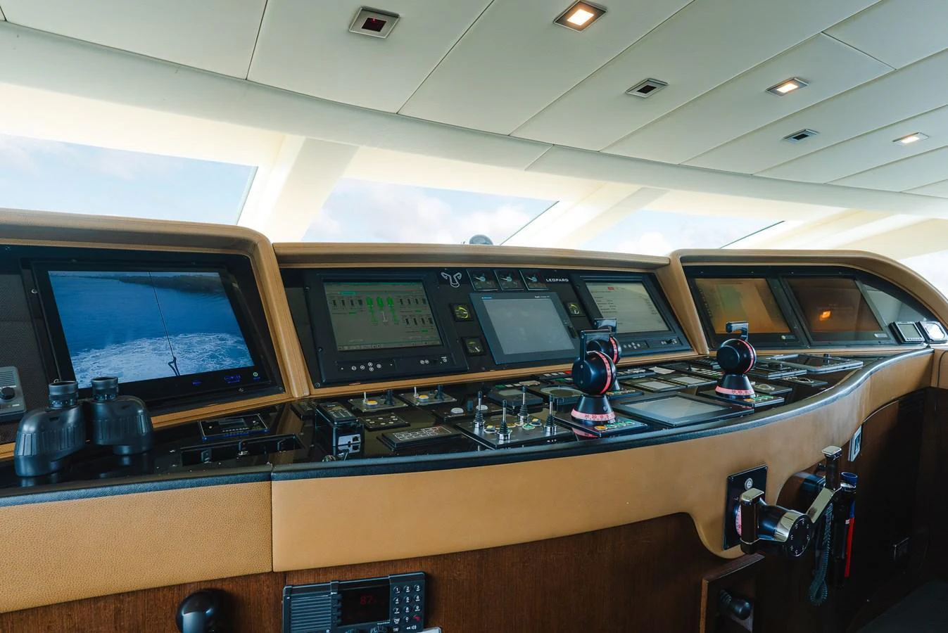 The helm features advanced navigation equipment and luxurious finishes. aboard BET ON IT Yacht for Sale