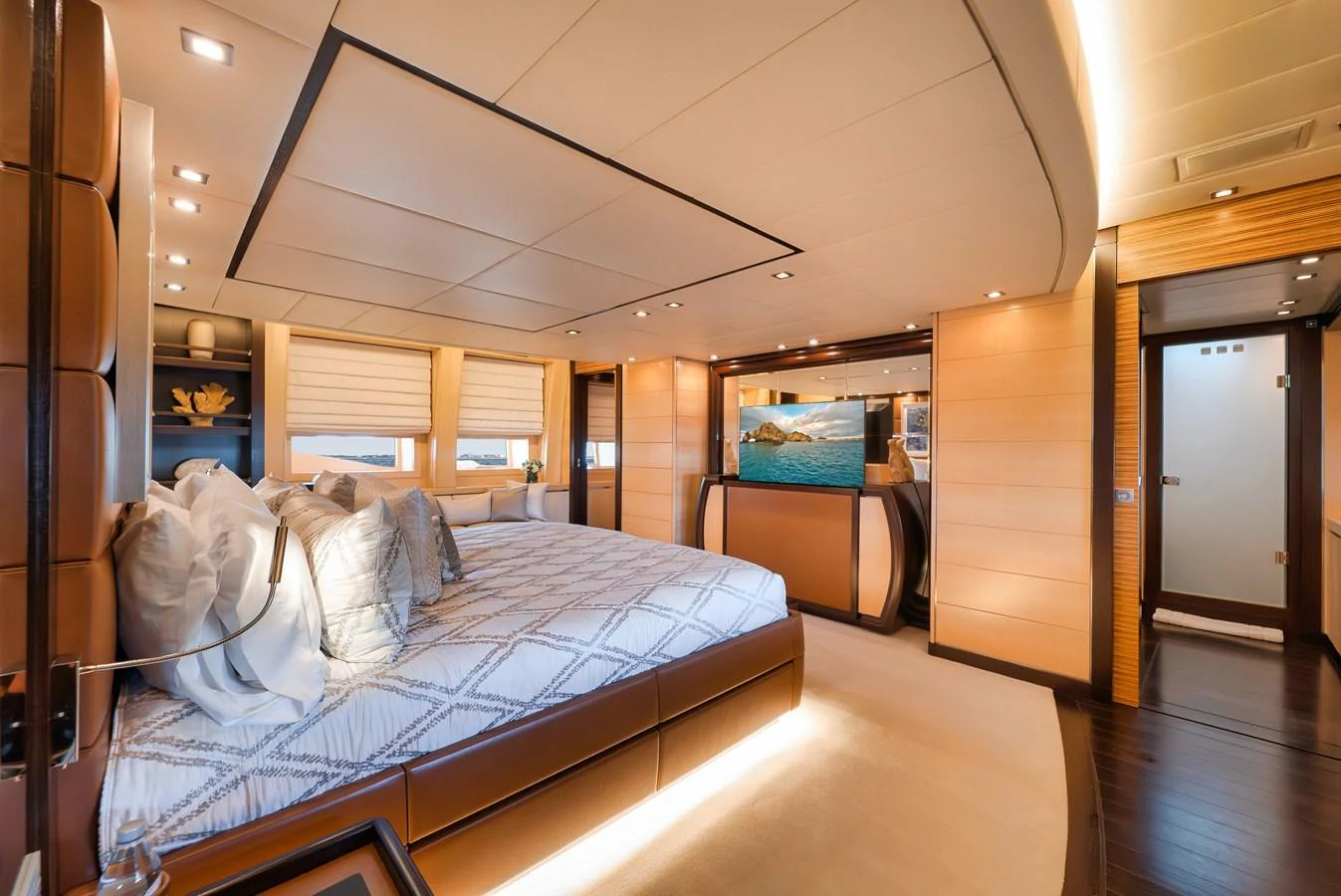 The master stateroom features luxurious bedding and elegant lighting. aboard BET ON IT Yacht for Sale
