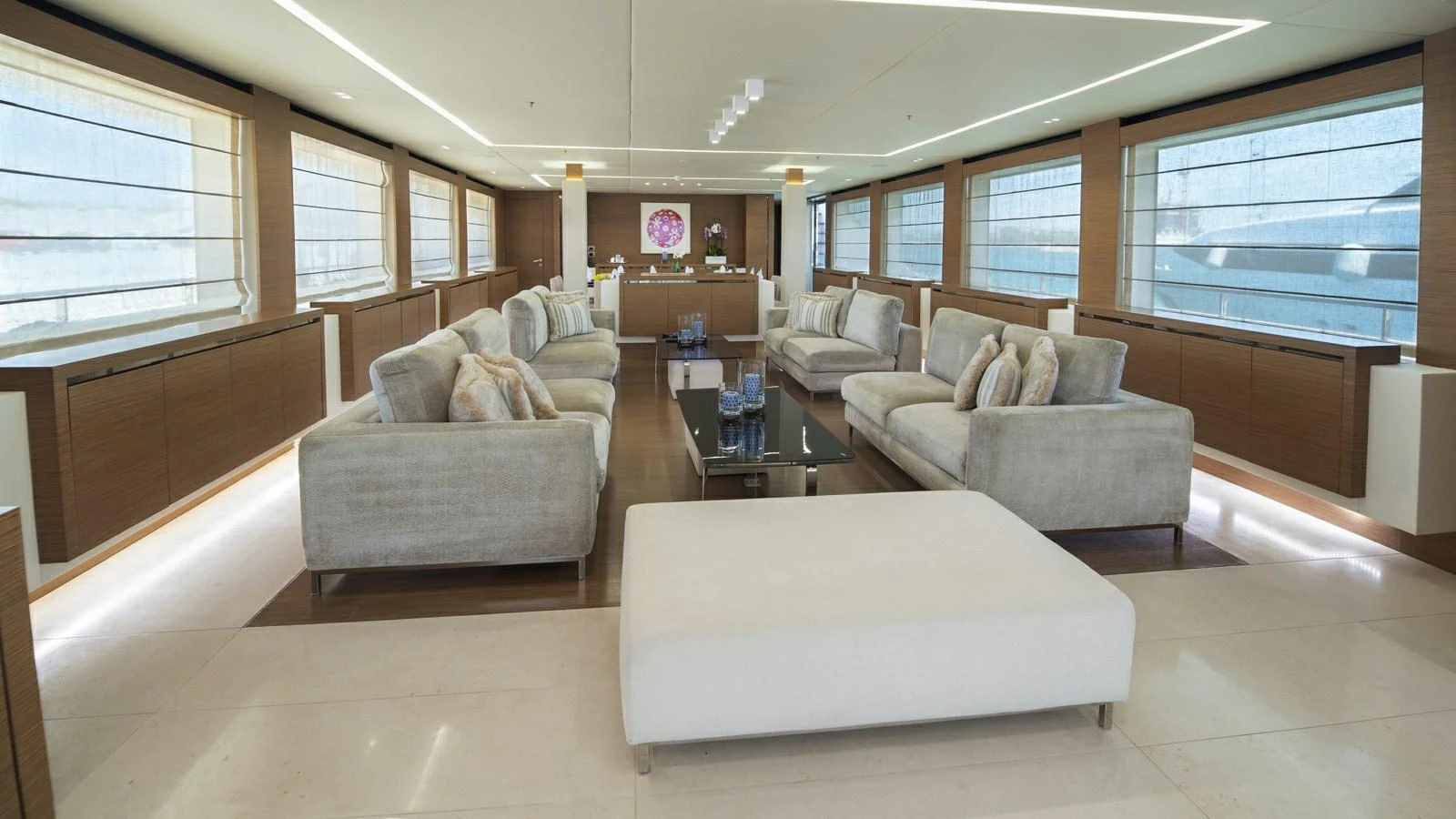 The spacious salon features modern furnishings and ample natural light. aboard IPANEMAS Yacht for Sale