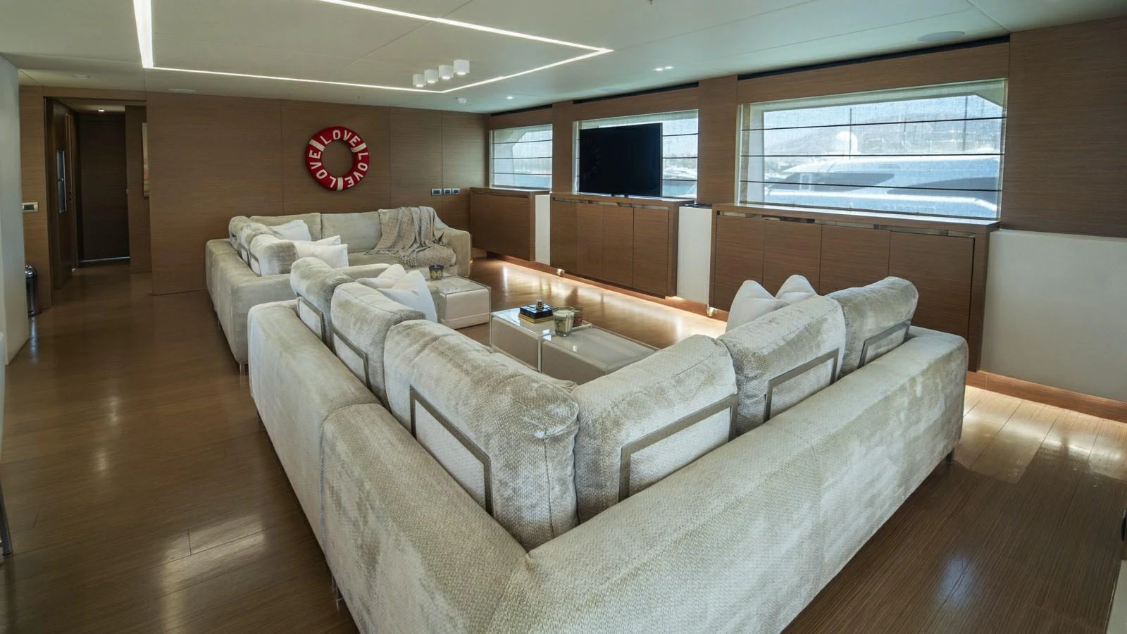 The salon features plush seating and modern decor, creating a comfortable and stylish living space. aboard IPANEMAS Yacht for Sale
