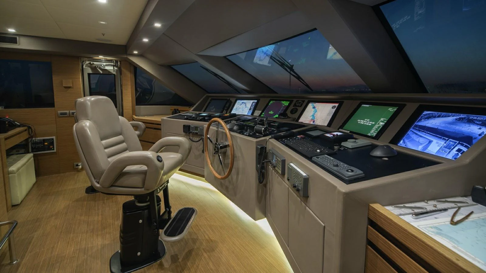 The helm station features advanced navigation equipment and a comfortable captain's chair. aboard IPANEMAS Yacht for Sale