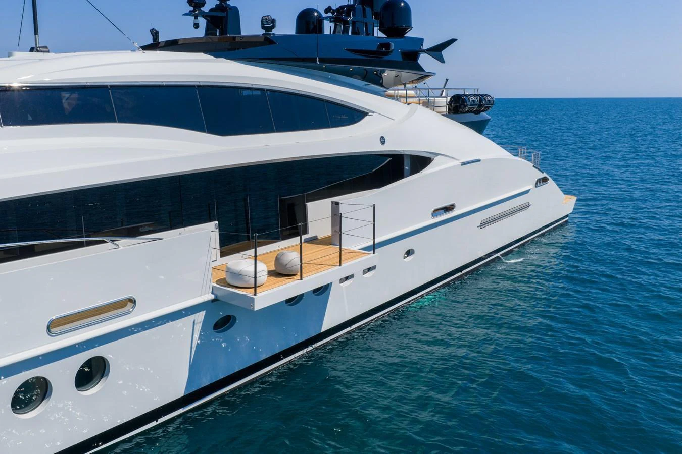 A sleek and modern yacht glides gracefully on the open sea, showcasing its elegant design and spacious deck. aboard FIVE Yacht for Sale