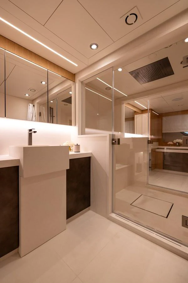 The yacht's bathroom features modern fixtures and a spacious, well-lit design. aboard FIVE Yacht for Sale