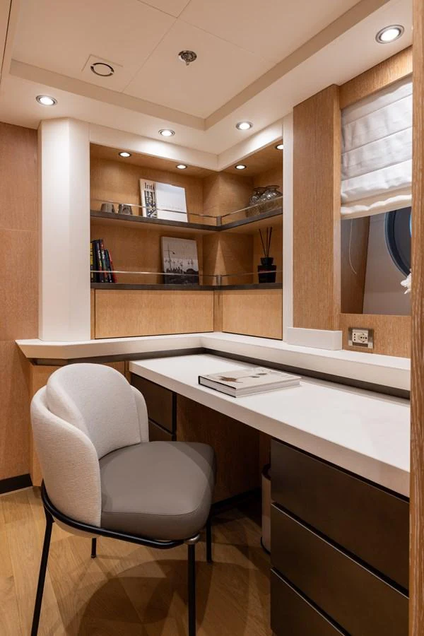 A stylish and functional office space with modern furnishings and ample storage. aboard FIVE Yacht for Sale