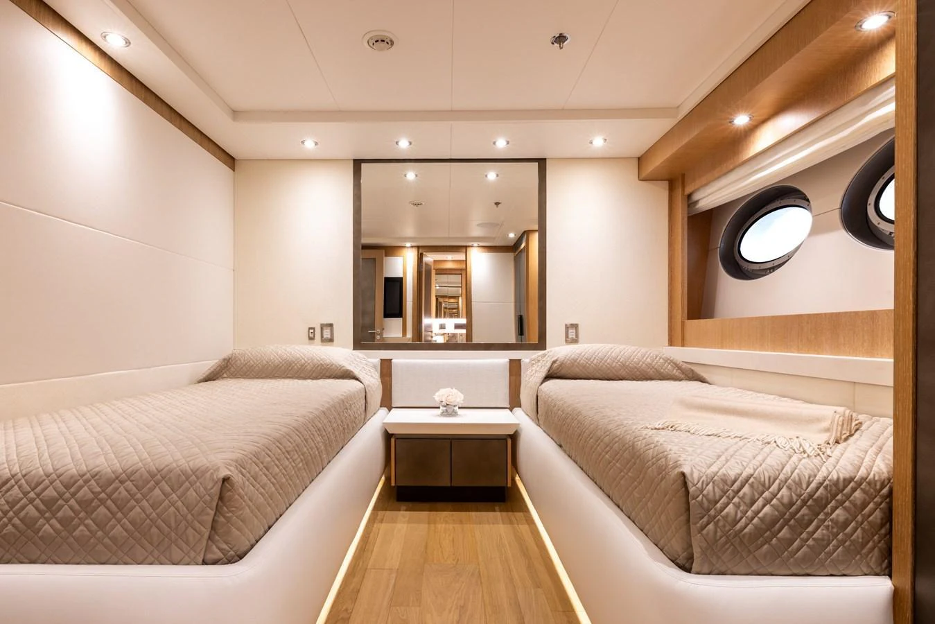 The twin stateroom offers a serene and comfortable sleeping area with modern design elements. aboard FIVE Yacht for Sale