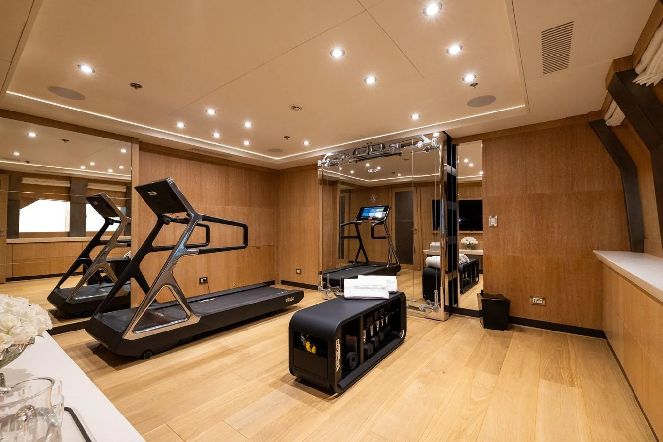 The yacht features a well-equipped gym with modern fitness equipment and a sleek design. aboard FIVE Yacht for Sale