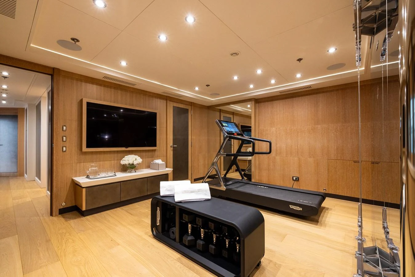 The yacht features a well-equipped gym with modern fitness equipment and a sleek design. aboard FIVE Yacht for Sale