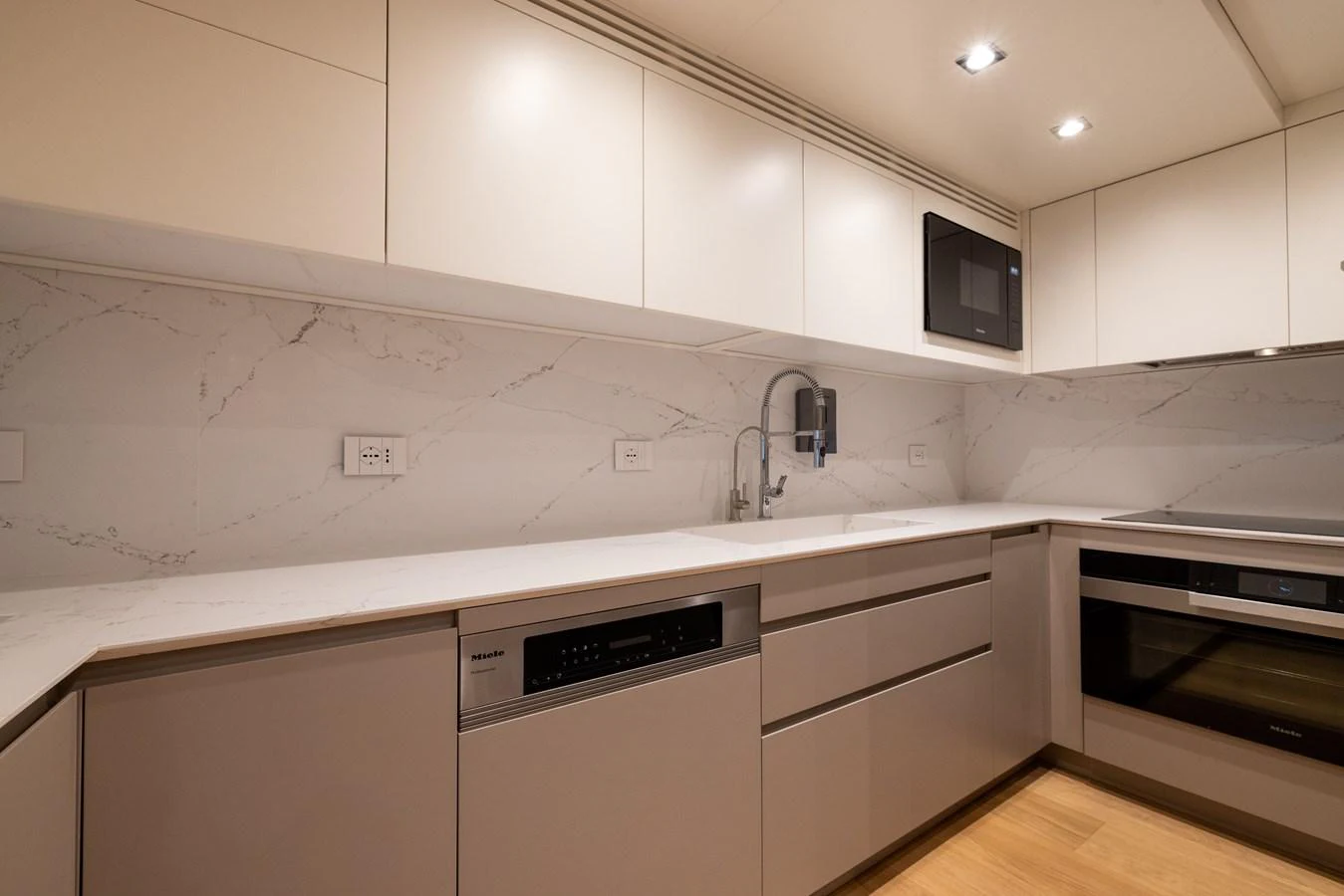 The yacht's galley features modern appliances and sleek, minimalist design. aboard FIVE Yacht for Sale