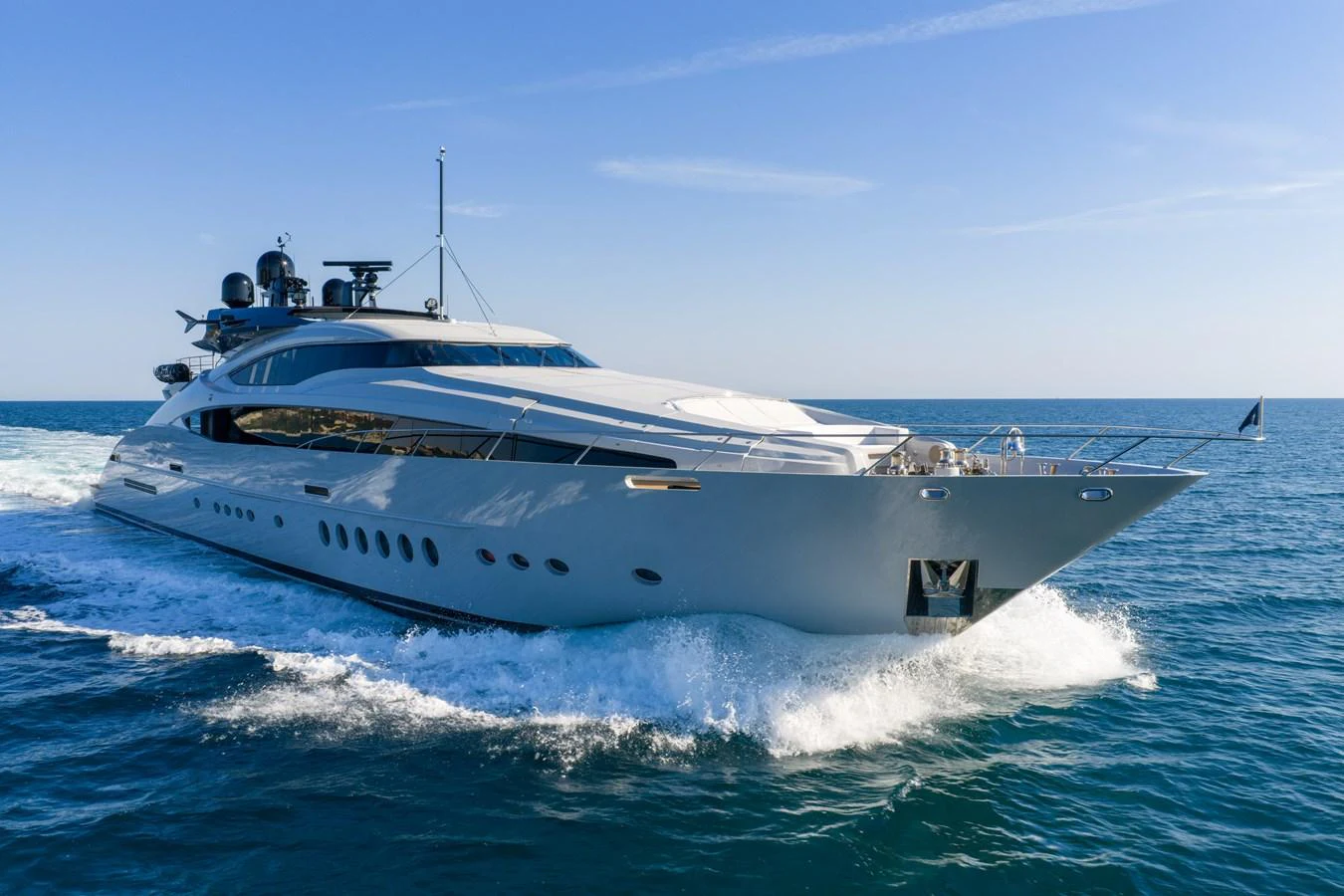 A sleek and modern yacht glides effortlessly through the open sea. aboard FIVE Yacht for Sale