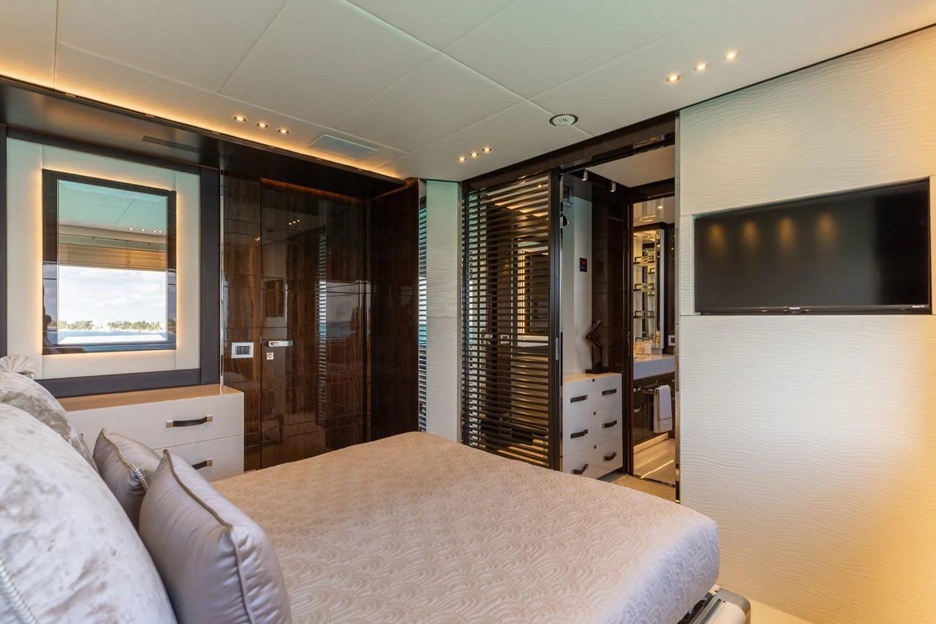 The master stateroom offers a luxurious and serene retreat with modern amenities and elegant design. aboard DOMANI Yacht for Sale