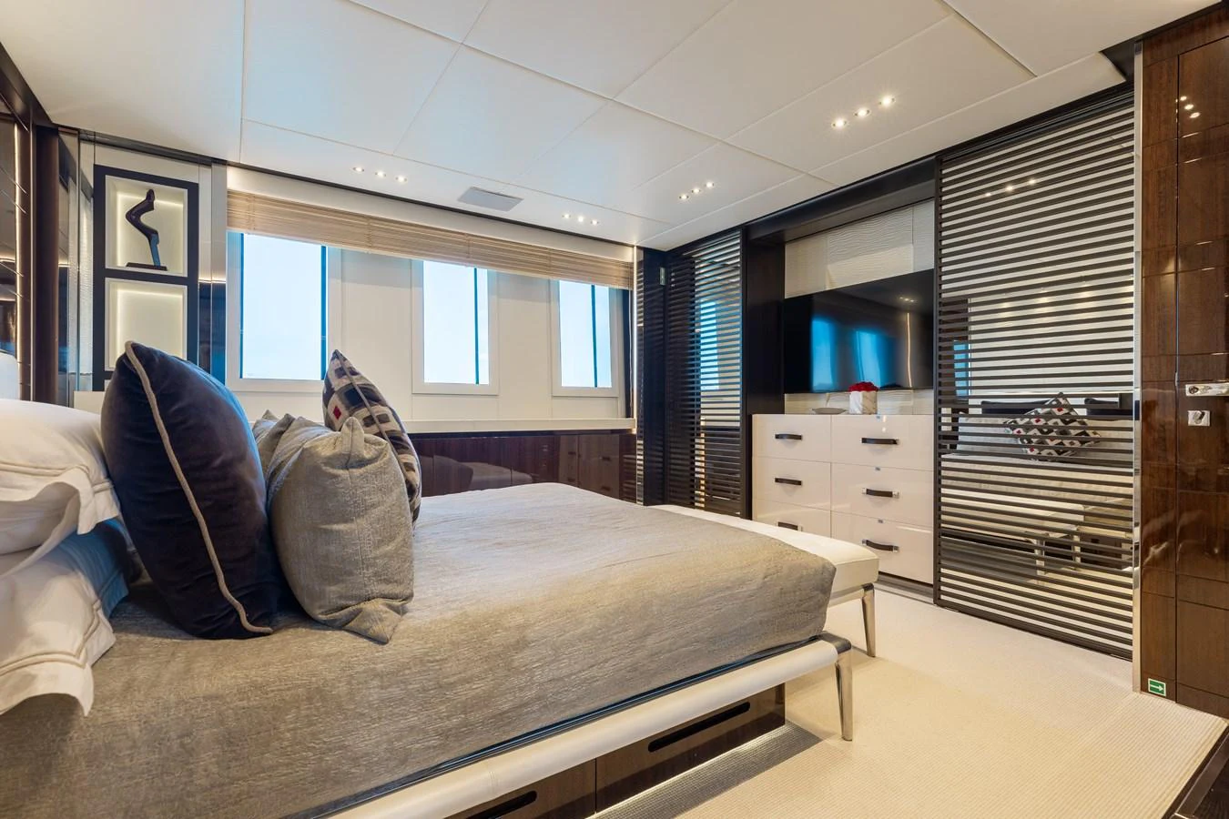 The stateroom exudes luxury with its spacious layout and modern decor. aboard DOMANI Yacht for Sale