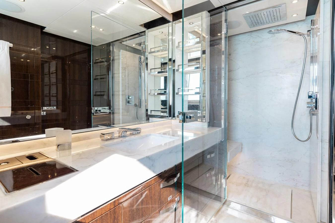The yacht's bathroom features a luxurious and modern design with high-end fixtures and finishes. aboard DOMANI Yacht for Sale
