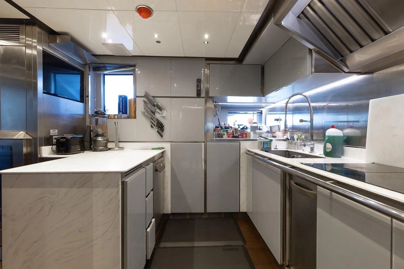 The yacht's galley is equipped with modern appliances and ample counter space, perfect for gourmet meal preparation. aboard DOMANI Yacht for Sale