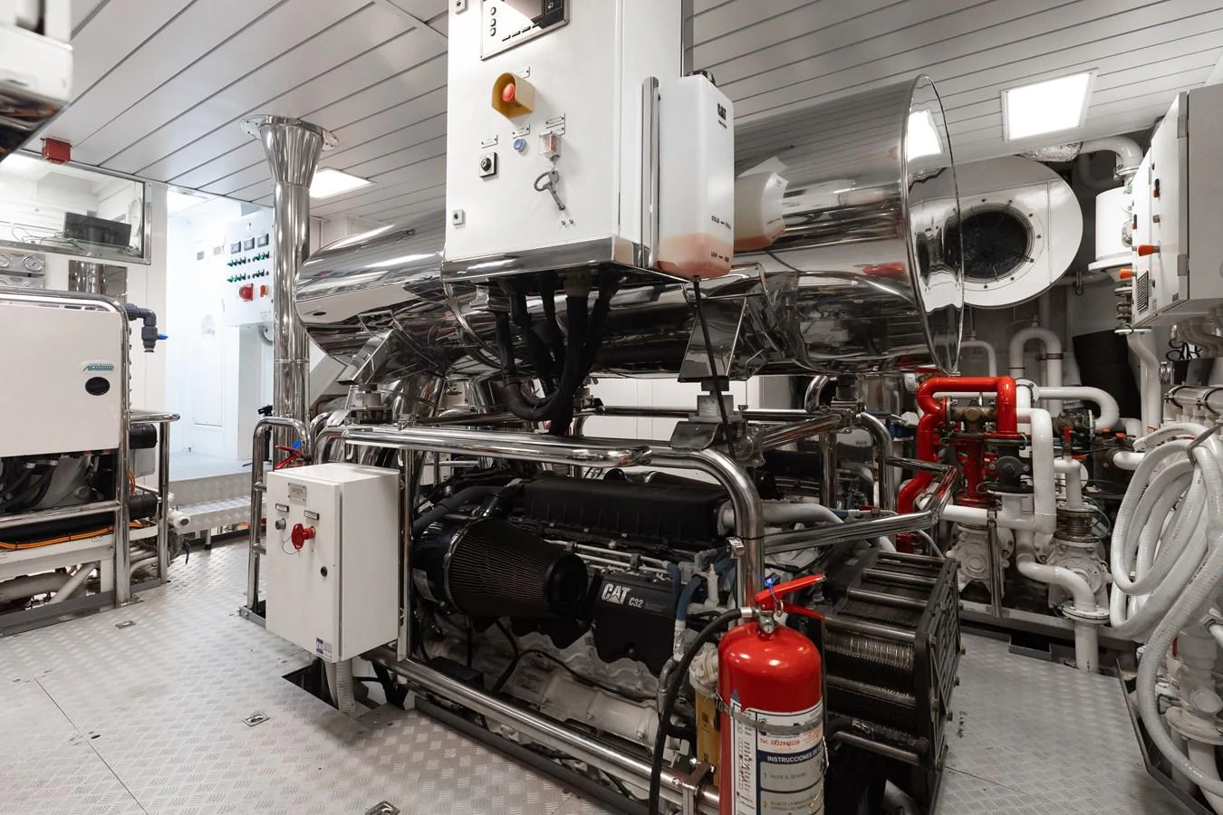 The engine room showcases advanced machinery and pristine maintenance. aboard DOMANI Yacht for Sale