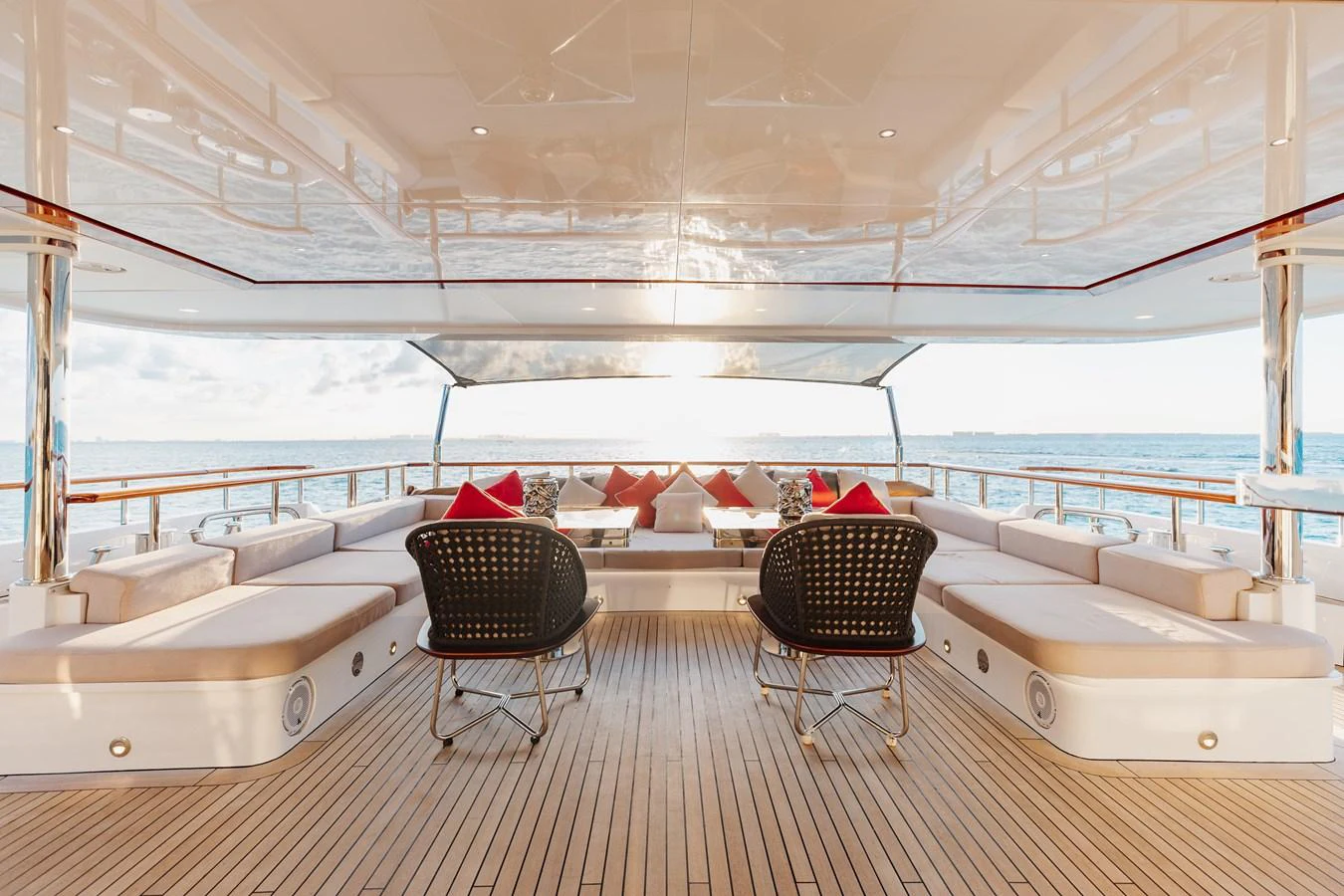 The aft deck offers a spacious and inviting area for relaxation and socializing with panoramic ocean views. aboard DOMANI Yacht for Sale