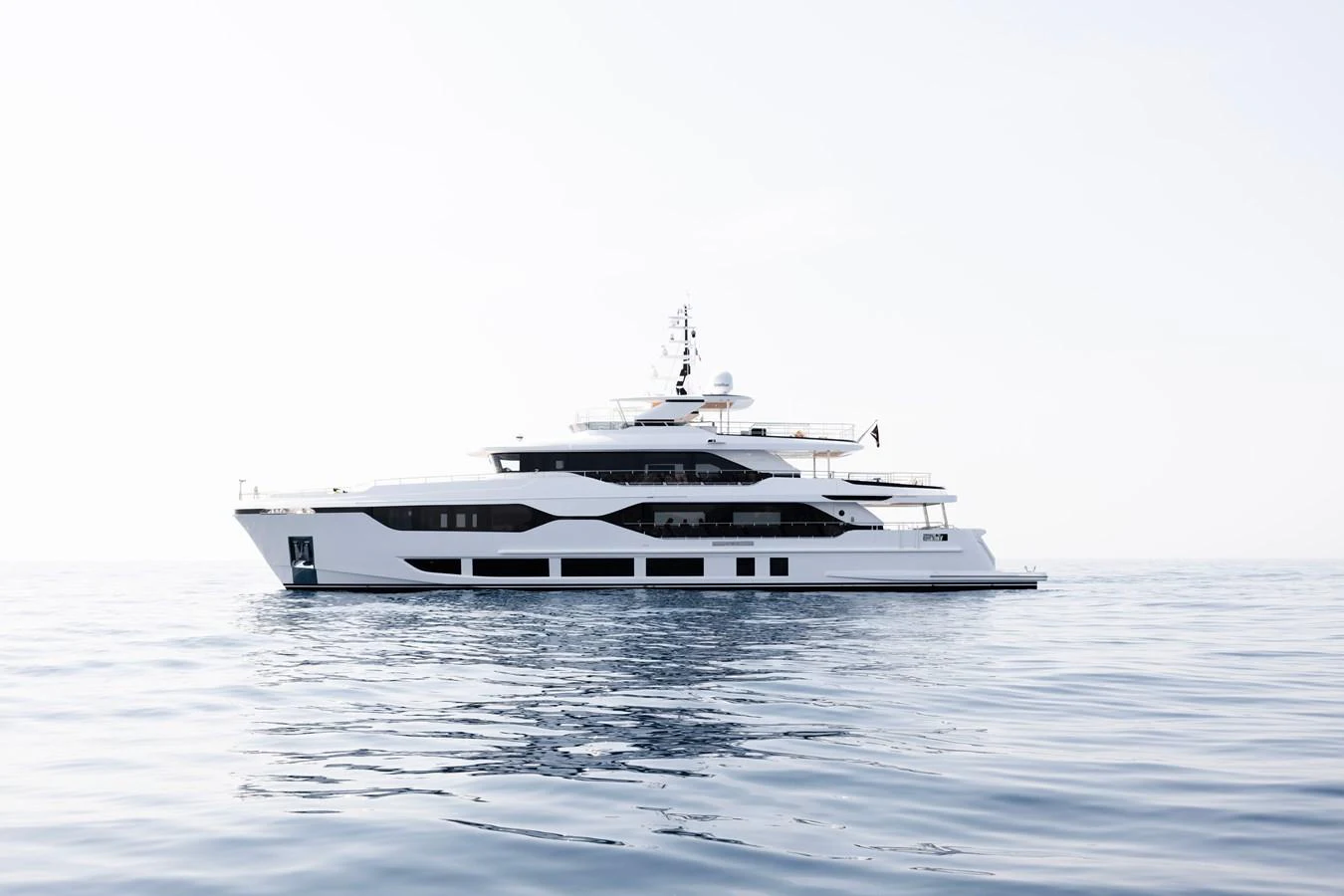a white boat on water aboard MAJESTY 120 Yacht for Sale