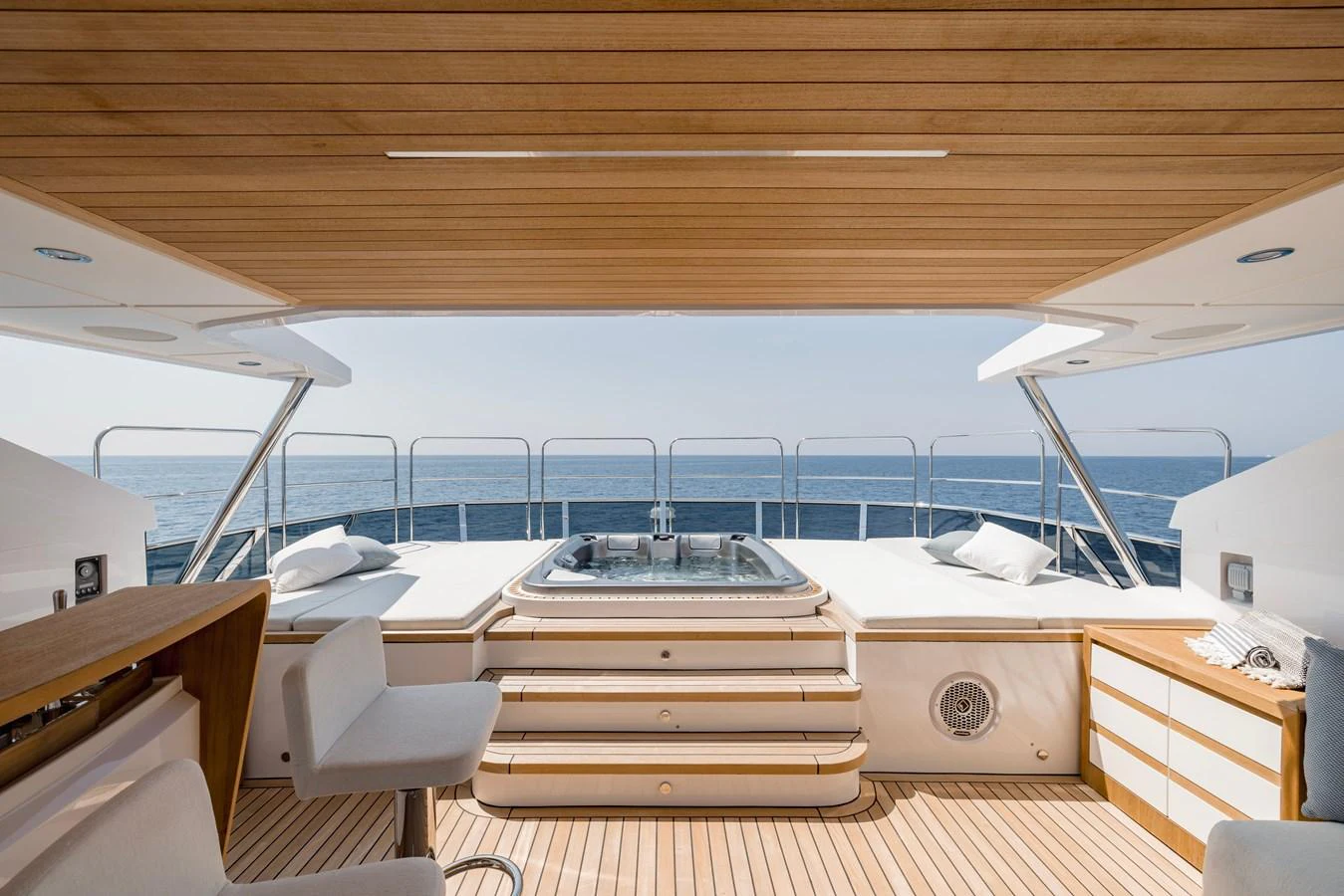 a room with a large deck and a large pool aboard MAJESTY 120 Yacht for Sale