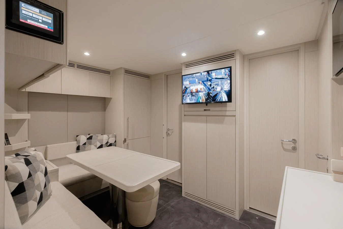 a bathroom with a bathtub and a tv on the wall aboard MAJESTY 120 Yacht for Sale