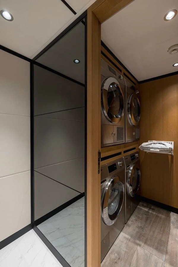 a bathroom with a washer and dryer aboard MAJESTY 120 Yacht for Sale